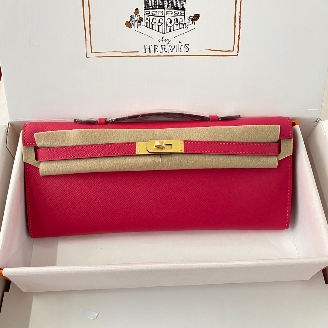 HERMES KELLY CUT 31 IN CHERRY RED CALFSKIN WITH GOLD HARDWARE