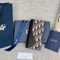DIOR VERTICAL BIFOLD WALLET 19 IN BLACK GRAINED CALFSKIN MIX BLUE MONOGRAM OBLIQUE JACQUARD
